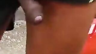 Показал свой черный член, не снимая шорт